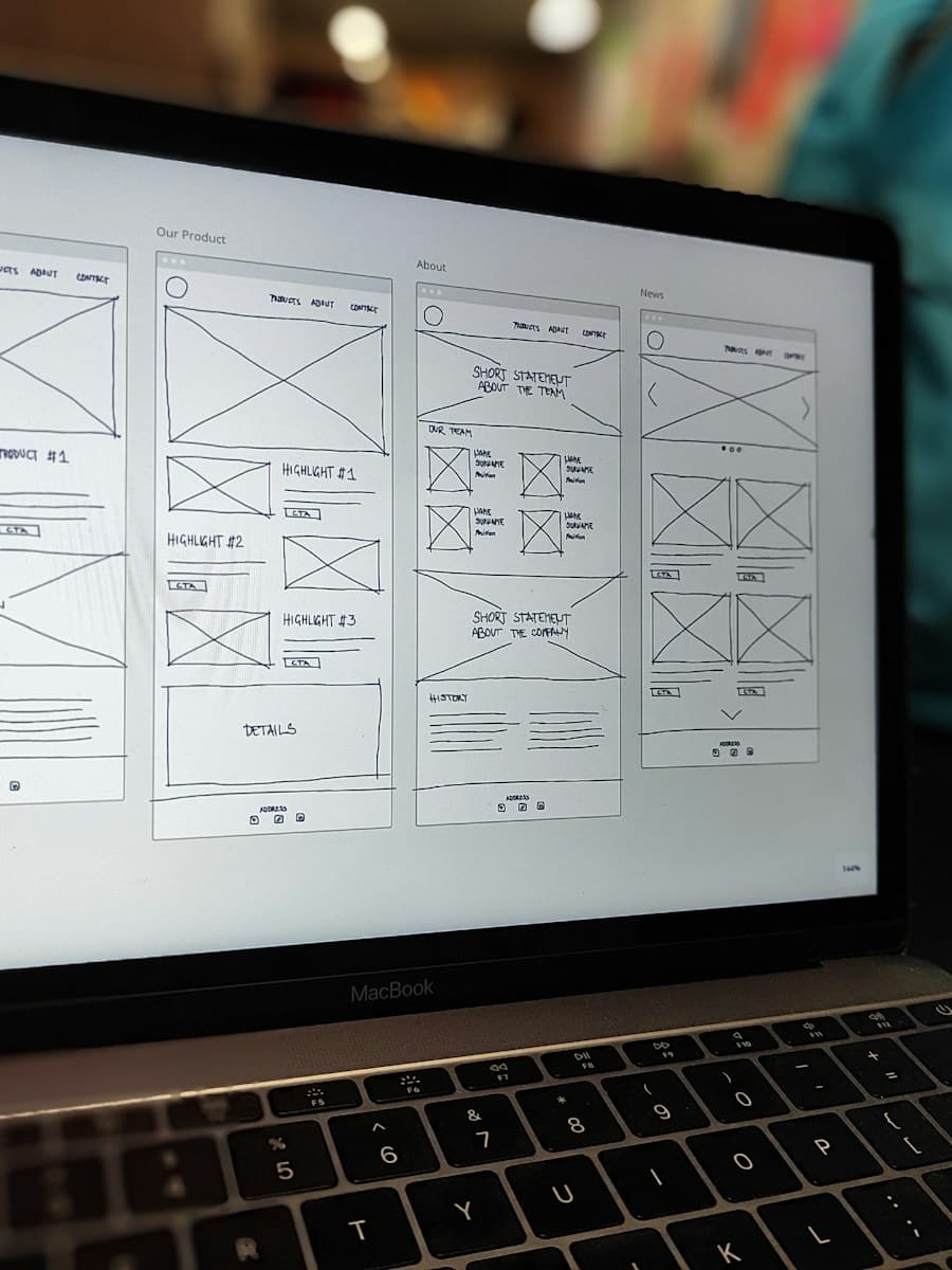 A page wireframe on a laptop